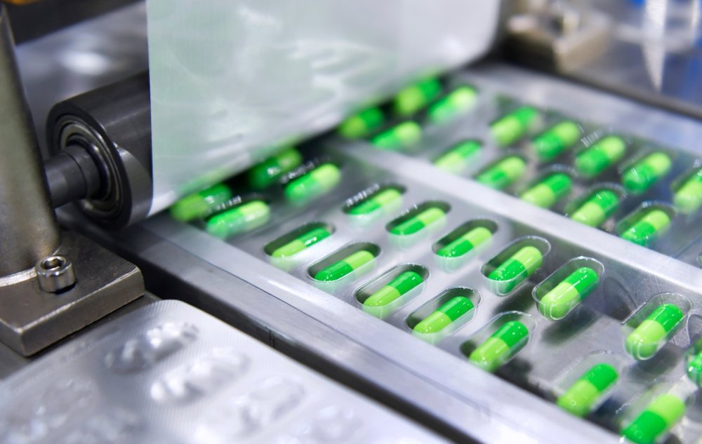 Green,Capsule,Medicine,Pill,Production,Line,,Industrial,Pharmaceutical,Concept