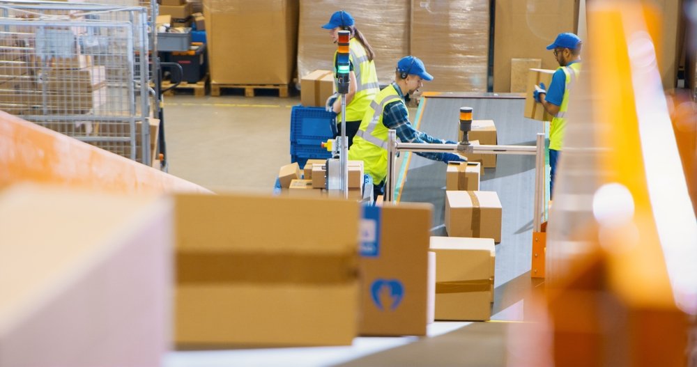 Workers,In,Logistics,Terminal,Loading,Cardboard,Boxes,And,Parcels,With